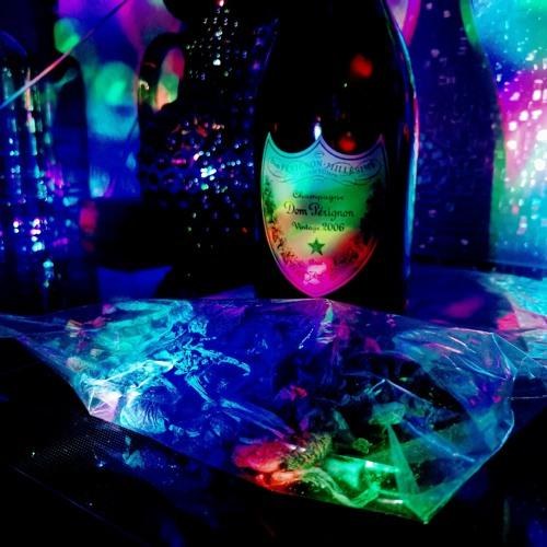 Dom Pérignon and a bag under ultraviolet club light